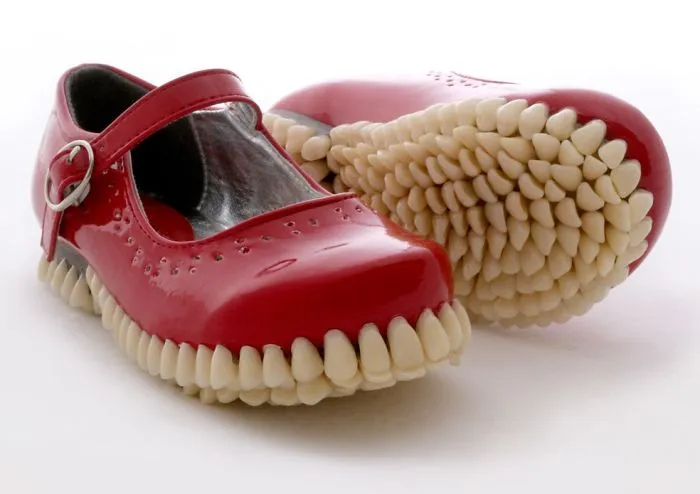 Bizarre Shoe Sculptures With Hundreds Of Artificial Teeth On Their Soles