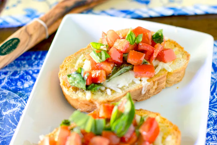 Caprese Crostini (crostini W/ Mozzarella, Tomato, Basil, And Herbs)