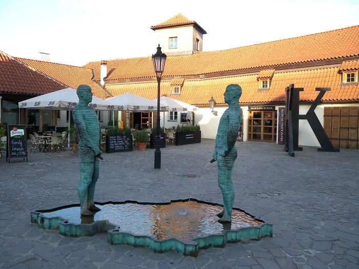 Prague. Bizarre Sculpture By David Cerny.you Can See This Sculpture In Front Of Kafka Museum