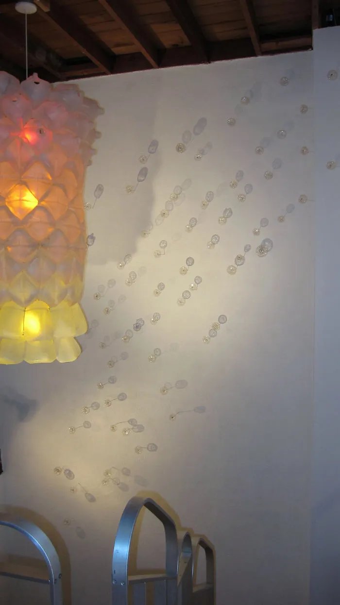Wall Flowers Made From Bottle Bottoms And A Milk Jug Lamp