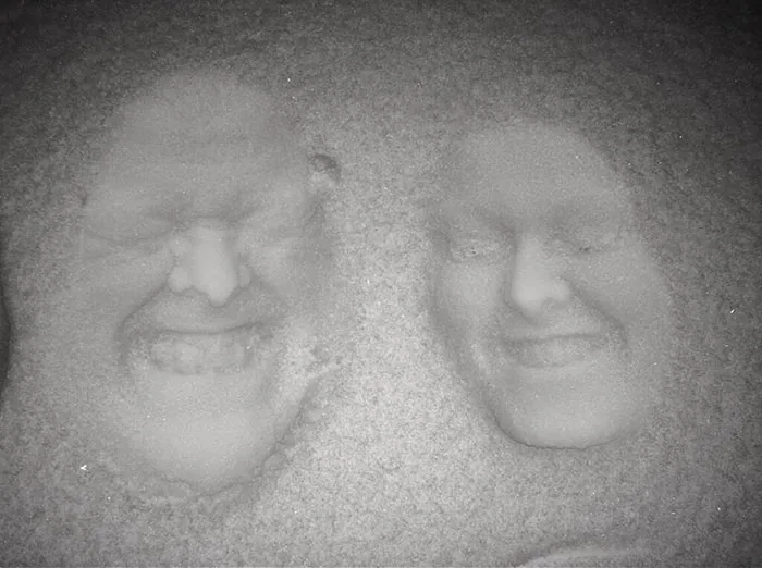 Forget Snow Angels - Father And Daughter Create 3D Images By Pressing Their Faces Into The Snow