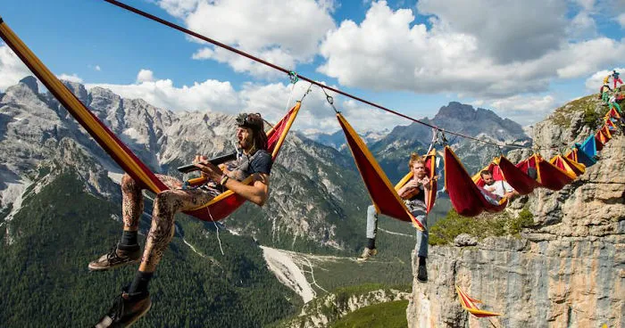 People At This Festival Slept On Hammocks Hanging Hundreds Of Feet Above The Italian Alps