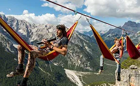 People At This Festival Slept On Hammocks Hanging Hundreds Of Feet Above The Italian Alps