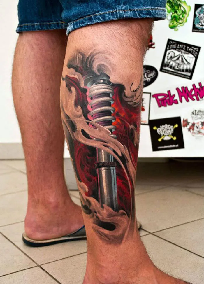 3D tattoo of a mechanical spring design on a person's calf, showcasing depth and intricate detail.