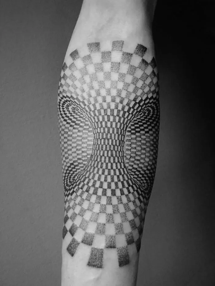 3D tattoo with optical illusion design creating a mind-bending, twisting effect on forearm.