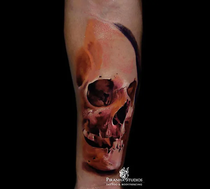 3D tattoo of a realistic skull on an arm, showcasing intricate details and depth effects.