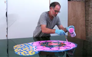 Artist Creates Psychedelic Art By Pouring Paint And Resin Onto A Canvas