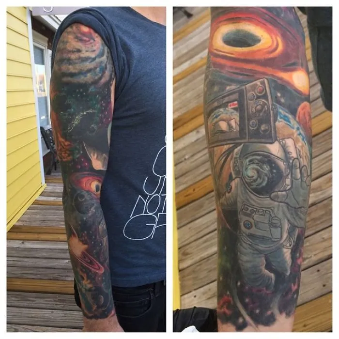 Colorful space tattoo on arm depicting cosmic scenery for astronomy lovers.