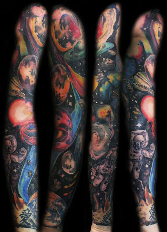 Colorful full arm tattoo of cosmic imagery for astronomy lovers.