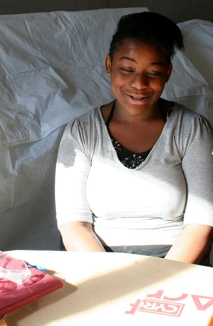 A Girl Delights In The Sunlight Shining On Her Table.