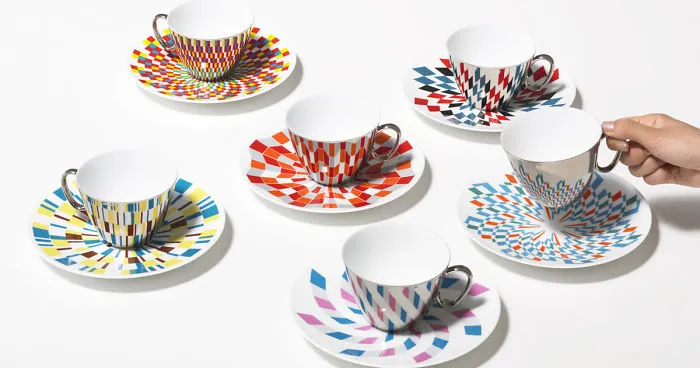 Mirror Teacups Reflect Colorful Patterns From The Saucers They're Placed On