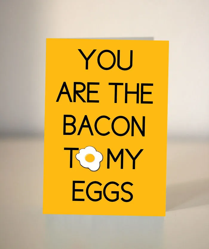 Yellow Valentine's Day card with the words "You are the bacon to my eggs" and an egg illustration.