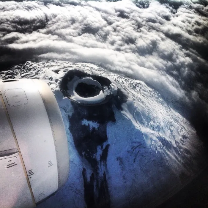 Photographer Captures View Down World's Highest Active Volcano Out Of Plane Window