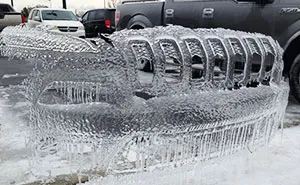 Frozen Cars Leave Icy Bumper Shells Behind After Ice Storm