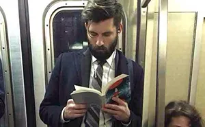 'Hot Dudes Reading' Books On Trains Is The Hottest Instagram Right Now