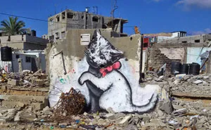 Banksy Sneaks Into Gaza To Create Controversial Street Art