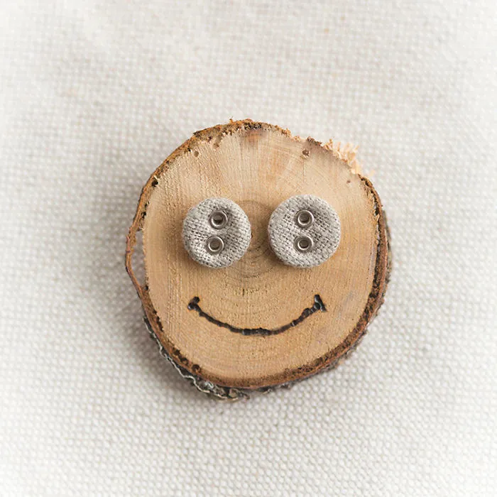 Linen Button Earrings On A Smiley Face