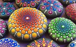 Artist Paints Ocean Stones With Thousands Of Tiny Dots To Create Colorful Mandalas
