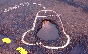Anonymous Artist 'Wanksy' Draws Penises On UK Potholes To Make Government Fix Them