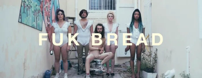 Artist Has His Dreadlocks, Beard, And Eyebrows Shaved Off By Dancers, Gets Bald Head Tattooed