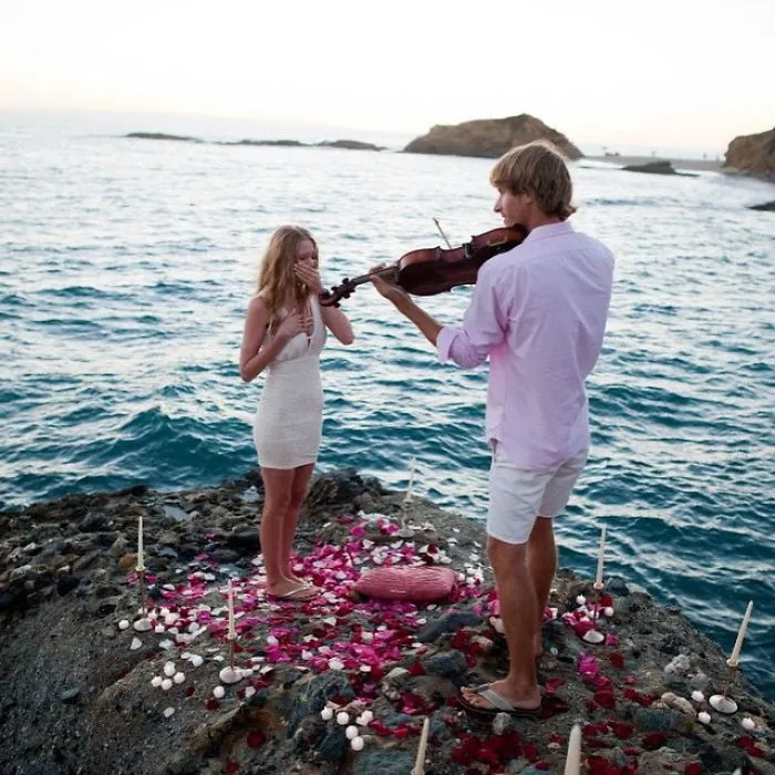 He led me through the rose petals to a spot at the end of the rocks. I didn't cry immediately. But then his eyes locked on mine and I lost it.
