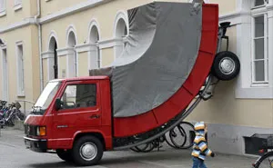 The German City Of Karlsruhe Just Issued A Parking Ticket To A Bent Car Sculpture By Austrian Artist Erwin Wurm