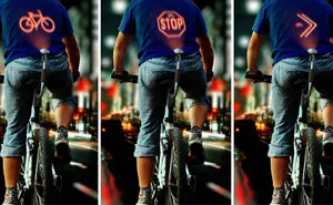 Bicycle-Mounted Device Projects Signals On Cyclists' Backs