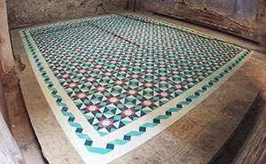 Artist Spray Paints Floors Of Abandoned Buildings With Colorful Tile Patterns