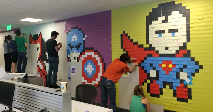 Worker Uses 8,024 Post-It Notes To Turn Boring Office Walls Into Superhero Murals