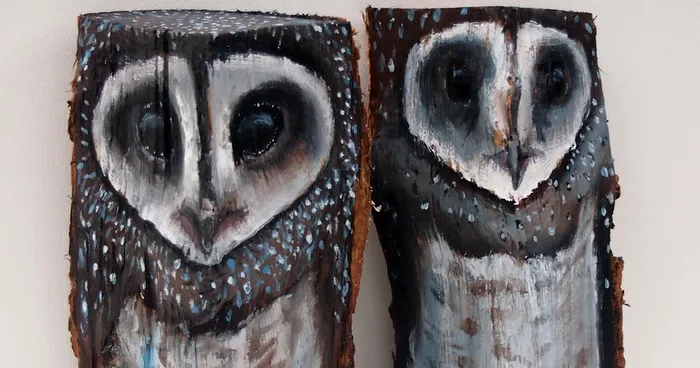 Owls On Wooden Logs
