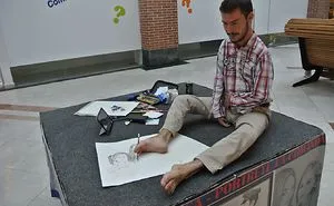 Romanian Artist Drawing With His Feet