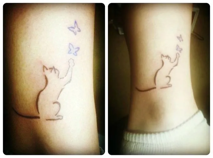 Simple line art cat tattoo design with butterflies, perfect for cat lovers.