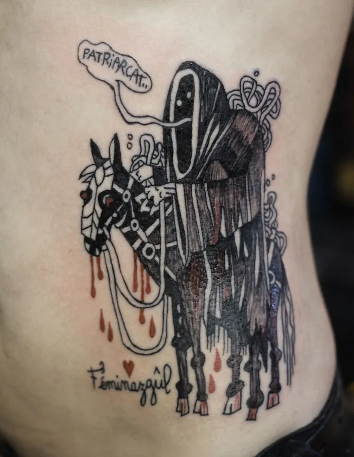 Tattoo of a hooded figure on a horse with speech bubble, inspired by Miyazaki films from Studio Ghibli.