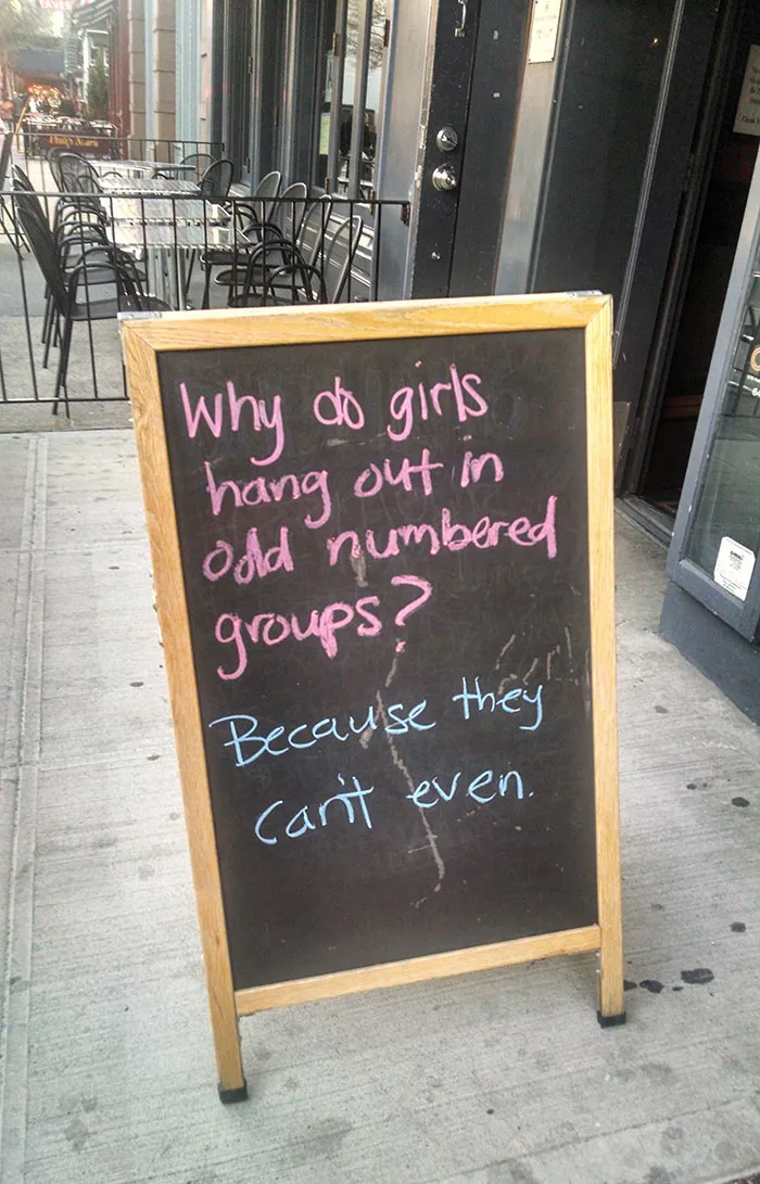 A Sign Outside Of A Bar