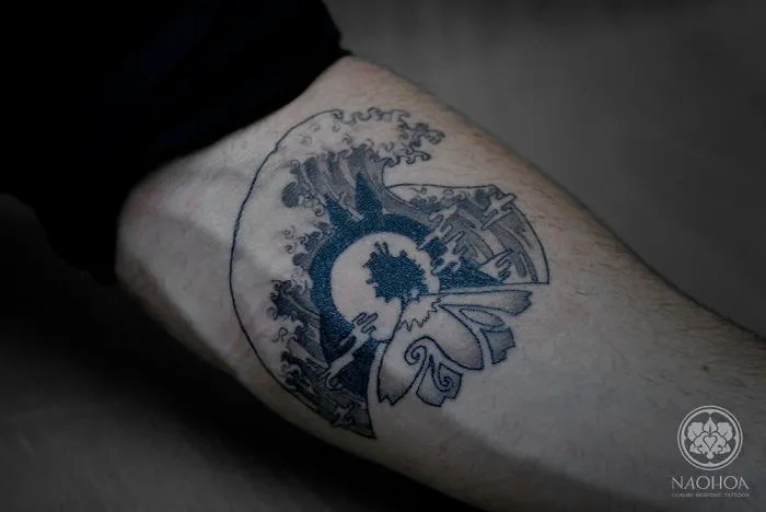 Studio Ghibli tattoo with intricate design inspired by Miyazaki films on forearm.