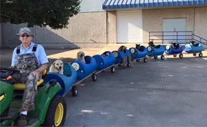 80-Year-Old Man Builds A Dog Train To Take Rescued Stray Dogs On Adventures