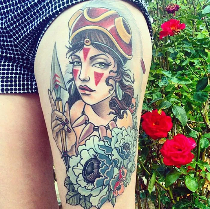 Studio Ghibli tattoo with a warrior design, inspired by Miyazaki films, on a person's leg near red roses.