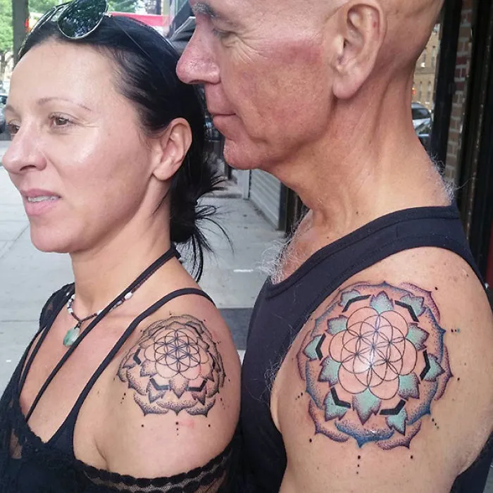 Couple with matching wedding tattoos on shoulders, symbolizing commitment without rings.