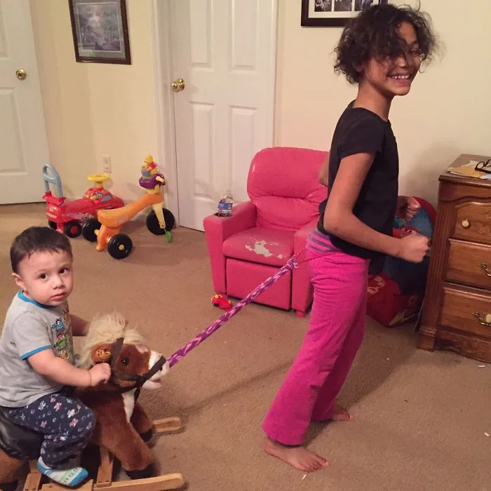 My 9 Yr Old Daughter Tirelessly Pulling Her Little Brother Around On His Horsey.
