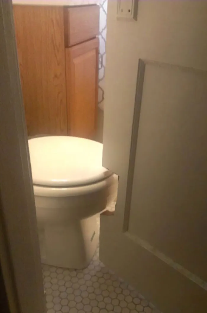 This Bathroom Door Is Cut Out So It Could Swing Past The Toilet