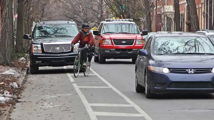 A Man Drives Down A Bike Trail
