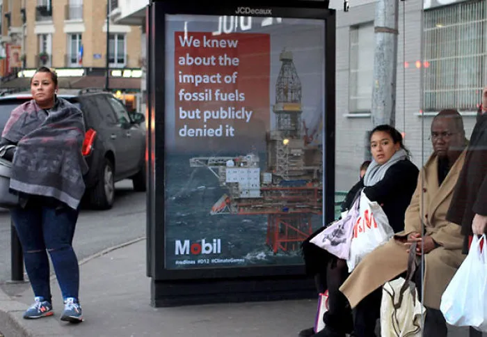 Artists Fill Paris With 600 Fake Ads To Protest Corporate Sponsorship Of Climate Conference