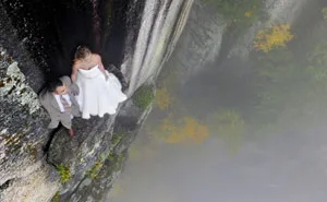 Photographer Shoots Bride And Groom On A Small Ledge 350Ft Above A Valley