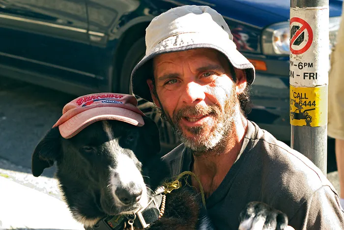 A Homeless Man And His Pet Companion