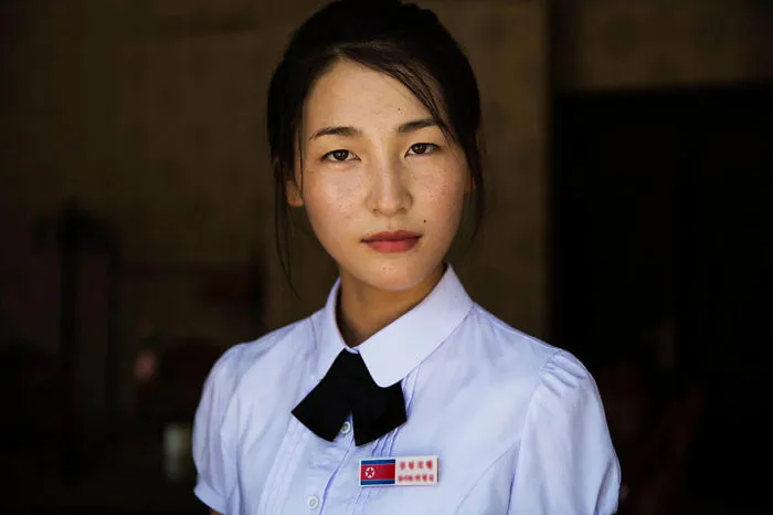 Romanian photographer captures a woman in traditional attire, highlighting global beauty.