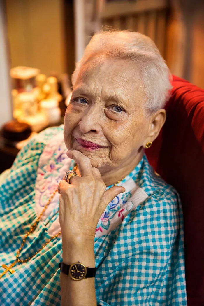 Elderly woman with a thoughtful expression, showcasing beauty in cultural diversity, photographed by a Romanian photographer.