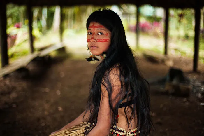 Romanian photographer captures a woman with long hair and face paint, highlighting global beauty diversity.