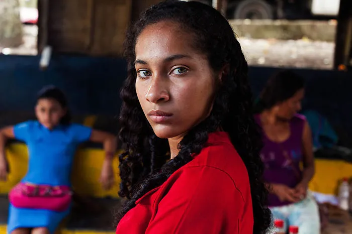 Woman from a diverse cultural background, photographed by a Romanian photographer, showcasing global beauty.
