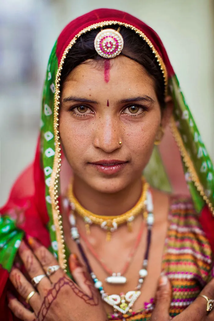Romanian photographer captures a woman in traditional attire, showcasing global beauty.