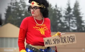 Aging Superhero Pulls Herself Up By Bra Straps To Become An Event Entertainer